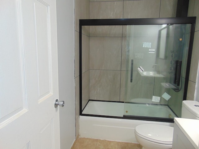 full bathroom with tile patterned flooring, vanity, toilet, and combined bath / shower with glass door