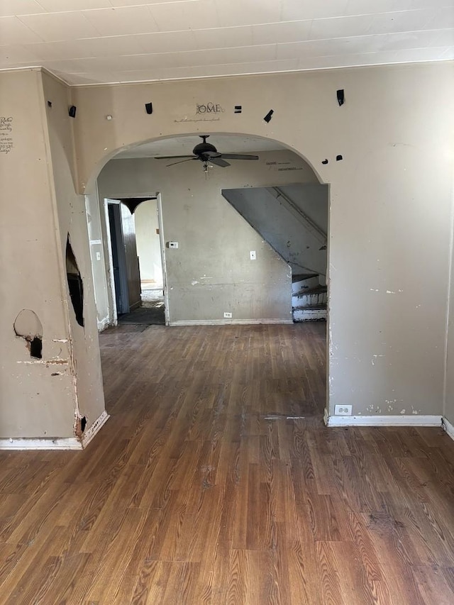 spare room with ceiling fan and dark hardwood / wood-style flooring