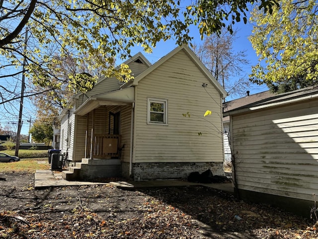 view of side of home with cooling unit