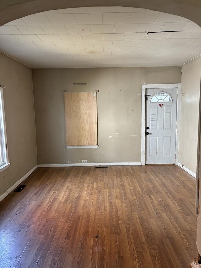 foyer entrance with dark wood-type flooring