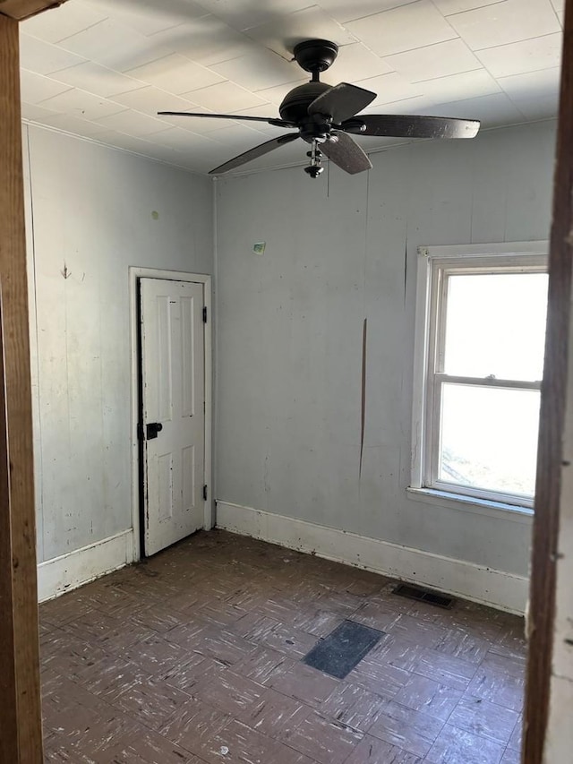 spare room with ceiling fan