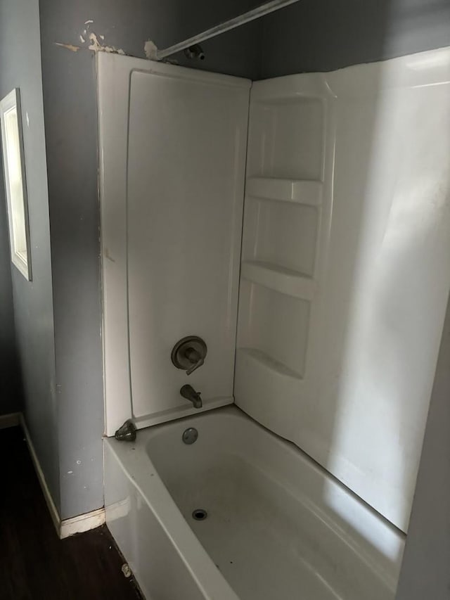 bathroom featuring washtub / shower combination