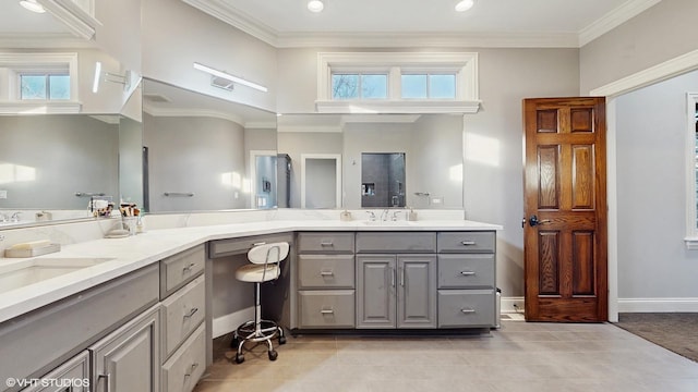 bathroom featuring vanity, tile patterned floors, and crown molding