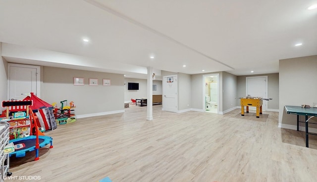 rec room with light hardwood / wood-style flooring