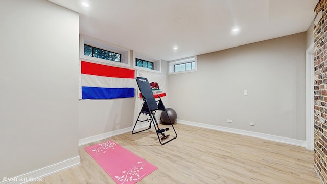 workout room with hardwood / wood-style flooring