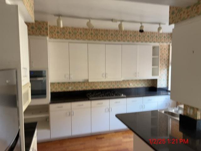 kitchen featuring white cabinetry