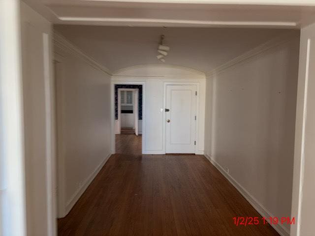 hallway featuring dark hardwood / wood-style floors