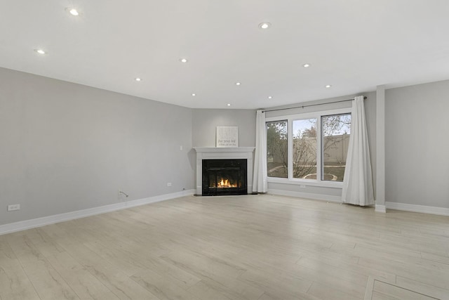 unfurnished living room featuring light hardwood / wood-style floors