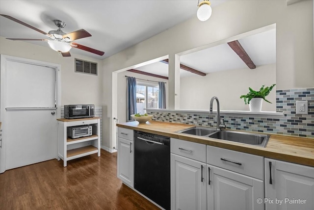 kitchen with sink, white cabinetry, black dishwasher, and butcher block counters