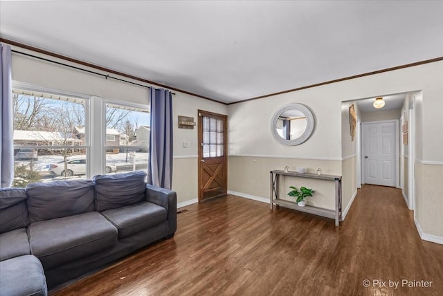 living room featuring dark hardwood / wood-style flooring and ornamental molding