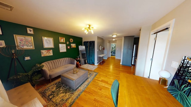 living room with light hardwood / wood-style flooring