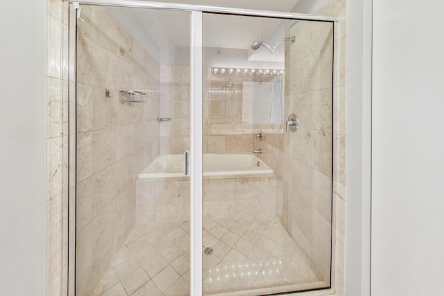 bathroom with bath / shower combo with glass door