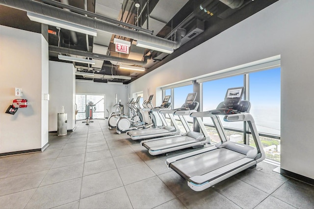 workout area featuring a high ceiling