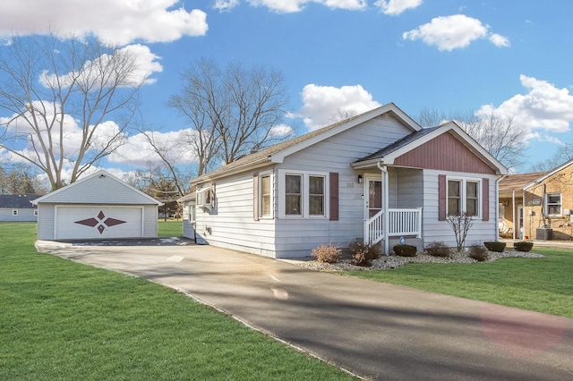 view of front facade with an outbuilding, a garage, and a front yard