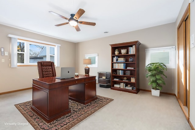 home office with ceiling fan and light colored carpet