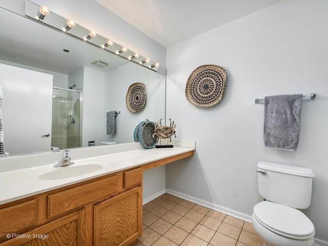 bathroom featuring toilet, walk in shower, vanity, and tile patterned flooring