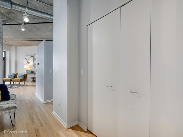 corridor featuring light hardwood / wood-style flooring