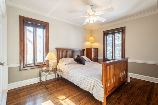 bedroom with ceiling fan, ornamental molding, dark hardwood / wood-style flooring, and multiple windows