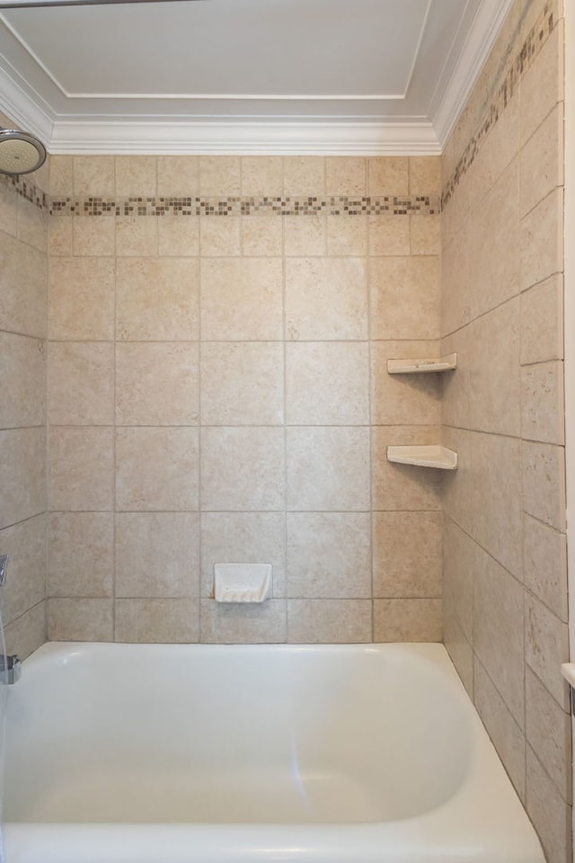 bathroom featuring ornamental molding and tiled shower / bath combo