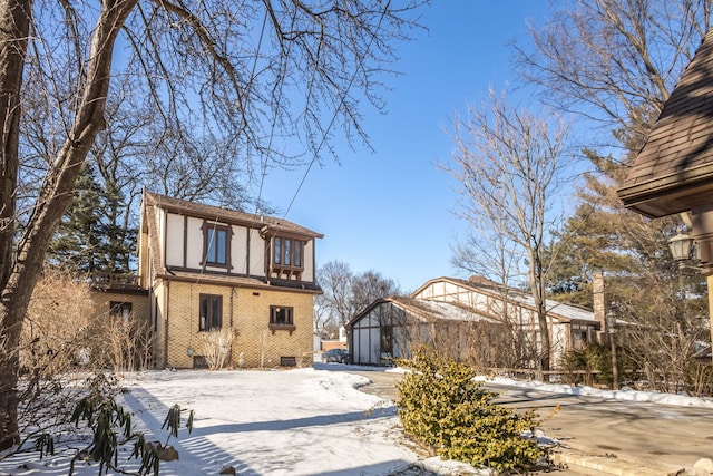 view of snow covered rear of property