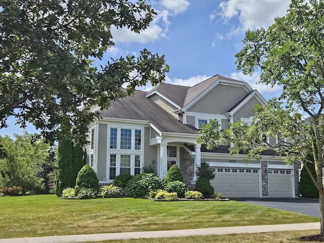 view of front of property with a garage and a front yard