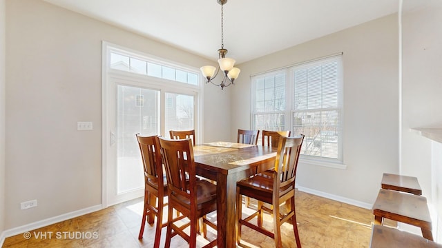 dining room with a chandelier