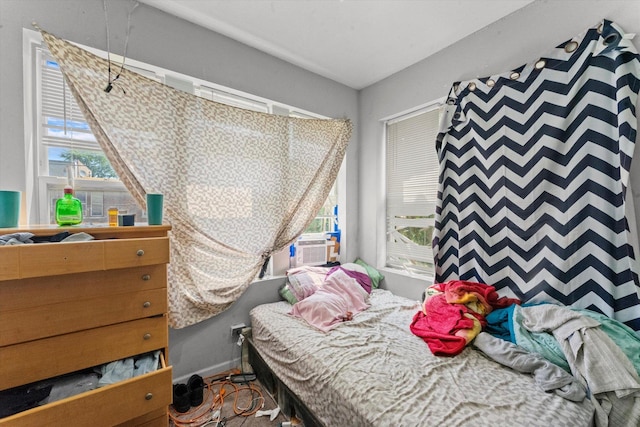 bedroom with multiple windows