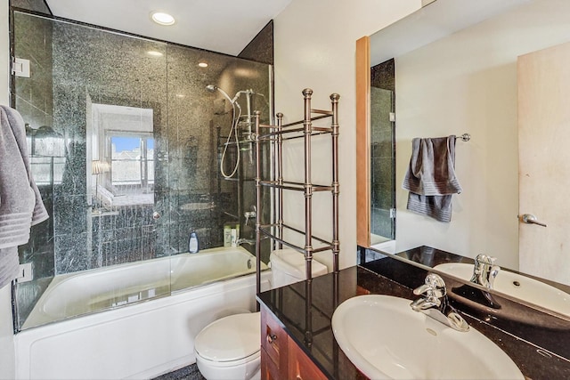 full bathroom featuring toilet, combined bath / shower with glass door, and sink