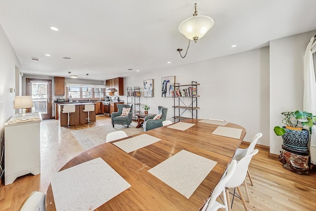 dining space featuring light hardwood / wood-style floors