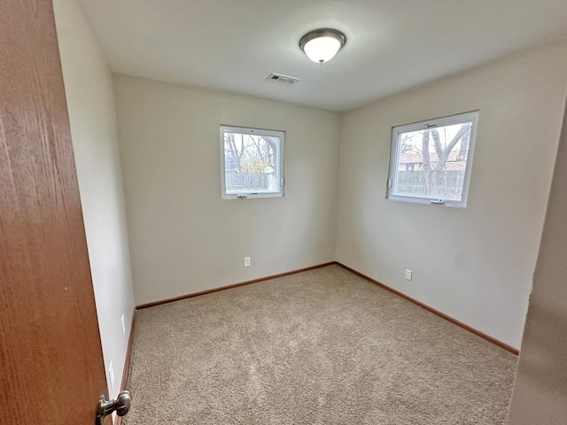 empty room featuring carpet floors