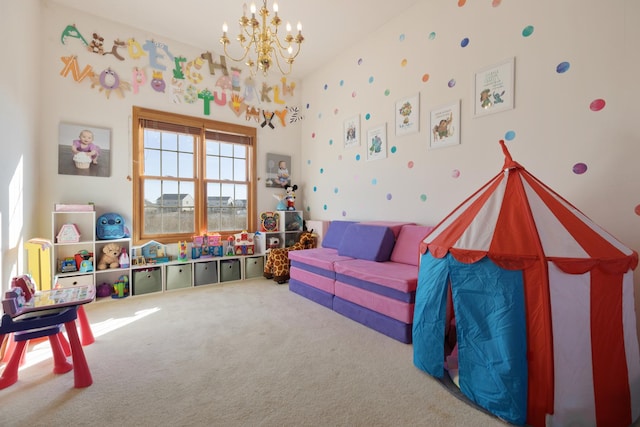 rec room with carpet and a notable chandelier