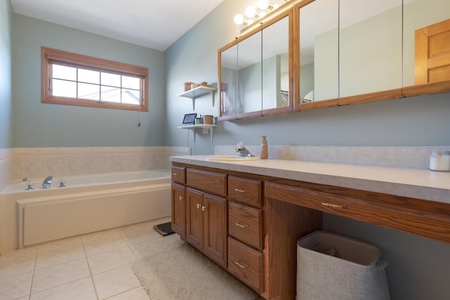 bathroom featuring tile patterned floors, a bathing tub, and vanity