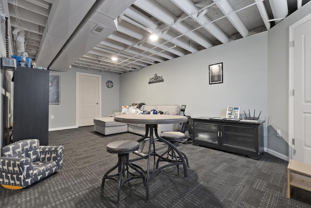 dining room with dark colored carpet