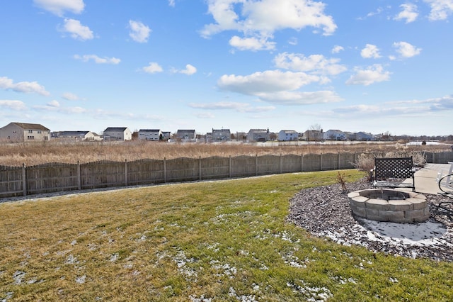 view of yard featuring an outdoor fire pit