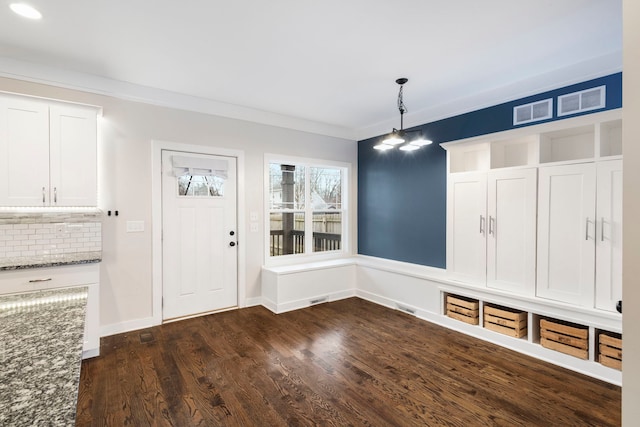 mudroom featuring dark hardwood / wood-style floors and ornamental molding