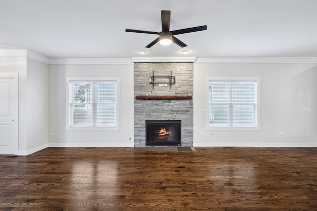 unfurnished living room featuring ceiling fan, a fireplace, dark hardwood / wood-style floors, and ornamental molding