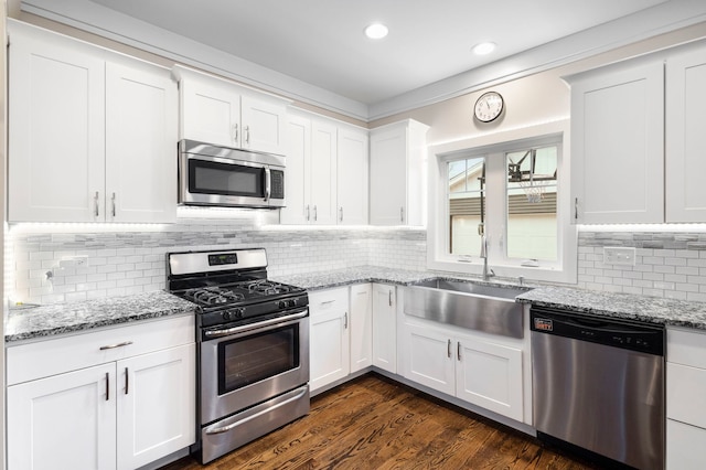 kitchen featuring white cabinetry, sink, and stainless steel appliances