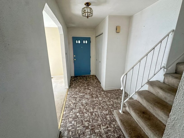 entryway featuring carpet floors