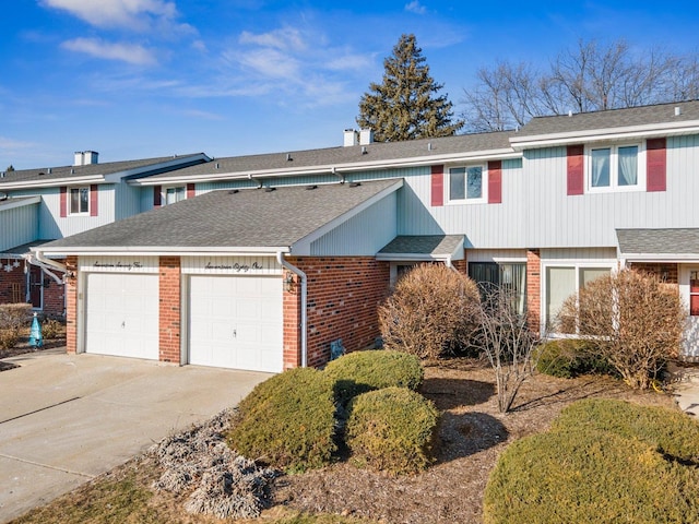 townhome / multi-family property featuring a garage