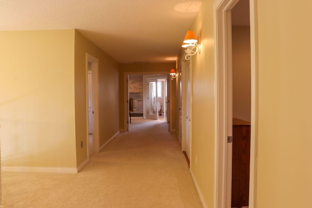 hallway with light carpet