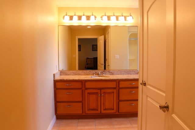 bathroom featuring tile patterned flooring and vanity