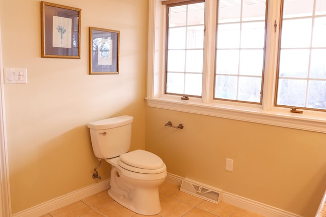 bathroom featuring tile patterned floors and toilet