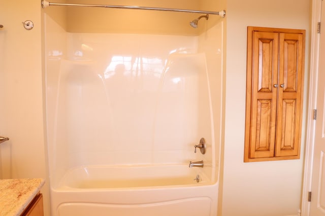 bathroom featuring vanity and bathing tub / shower combination