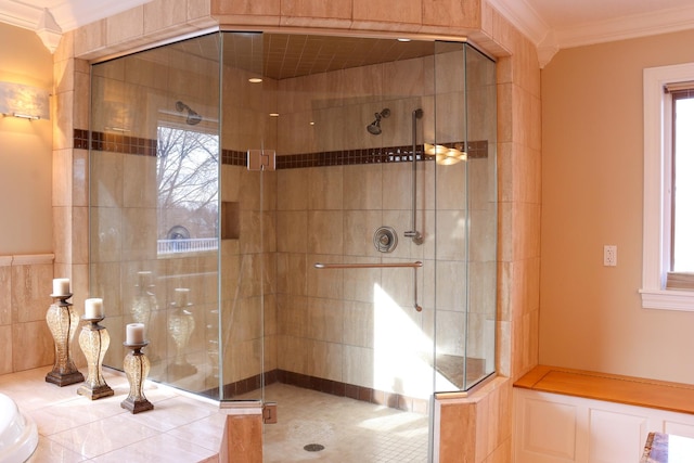 bathroom featuring crown molding, plenty of natural light, and walk in shower