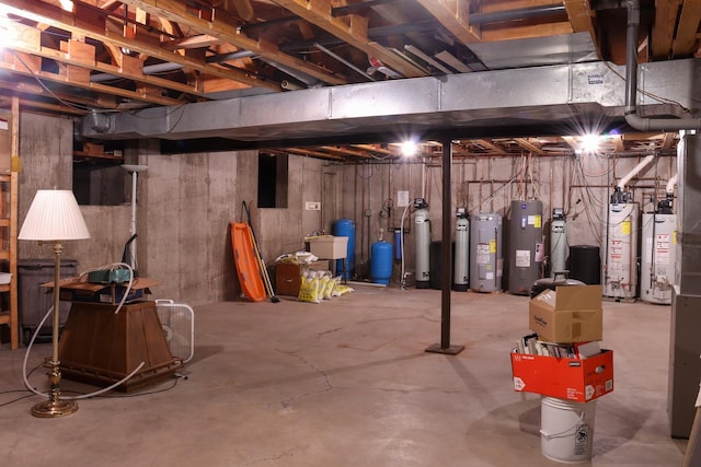 basement with gas water heater and water heater