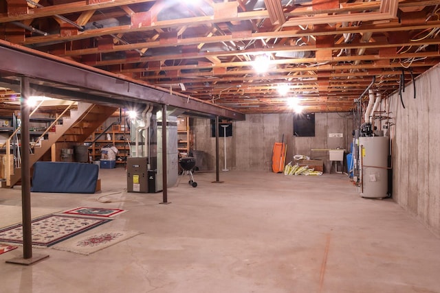 basement featuring heating unit and water heater