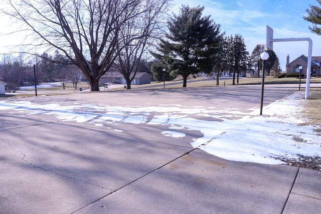 view of yard with basketball hoop