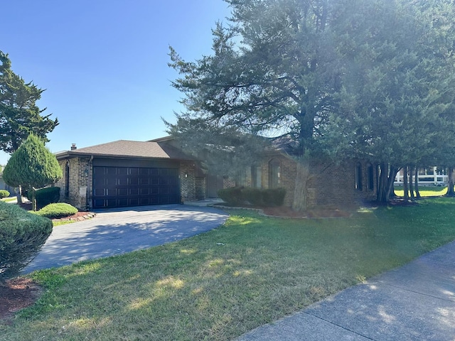 view of front facade with a front yard and a garage