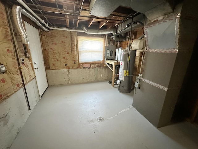 basement with electric panel and water heater