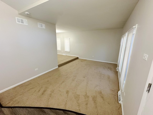 unfurnished room with carpet flooring